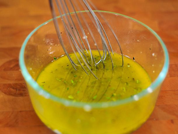 The marinade is whisked together in a glass prep bowl.