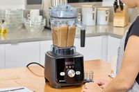 A person looking at the Vitamix Ascent X5 Blender