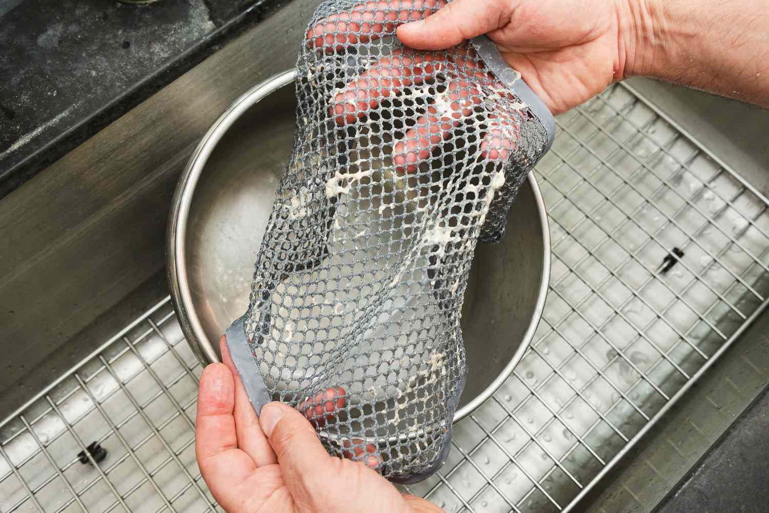 a hand holding a dough cleaning cloth 