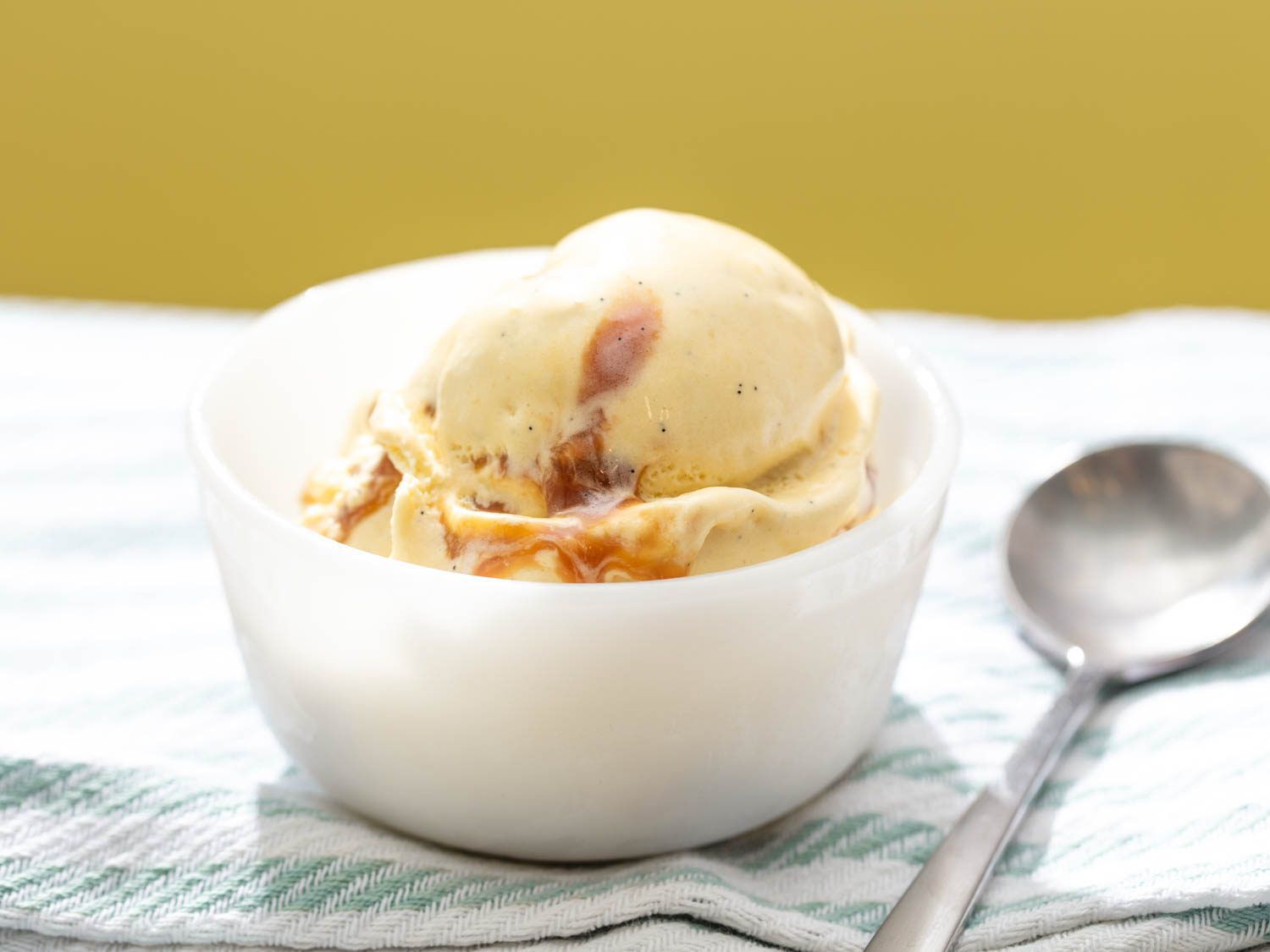 a scoop of banana ice cream with a caramel swirl