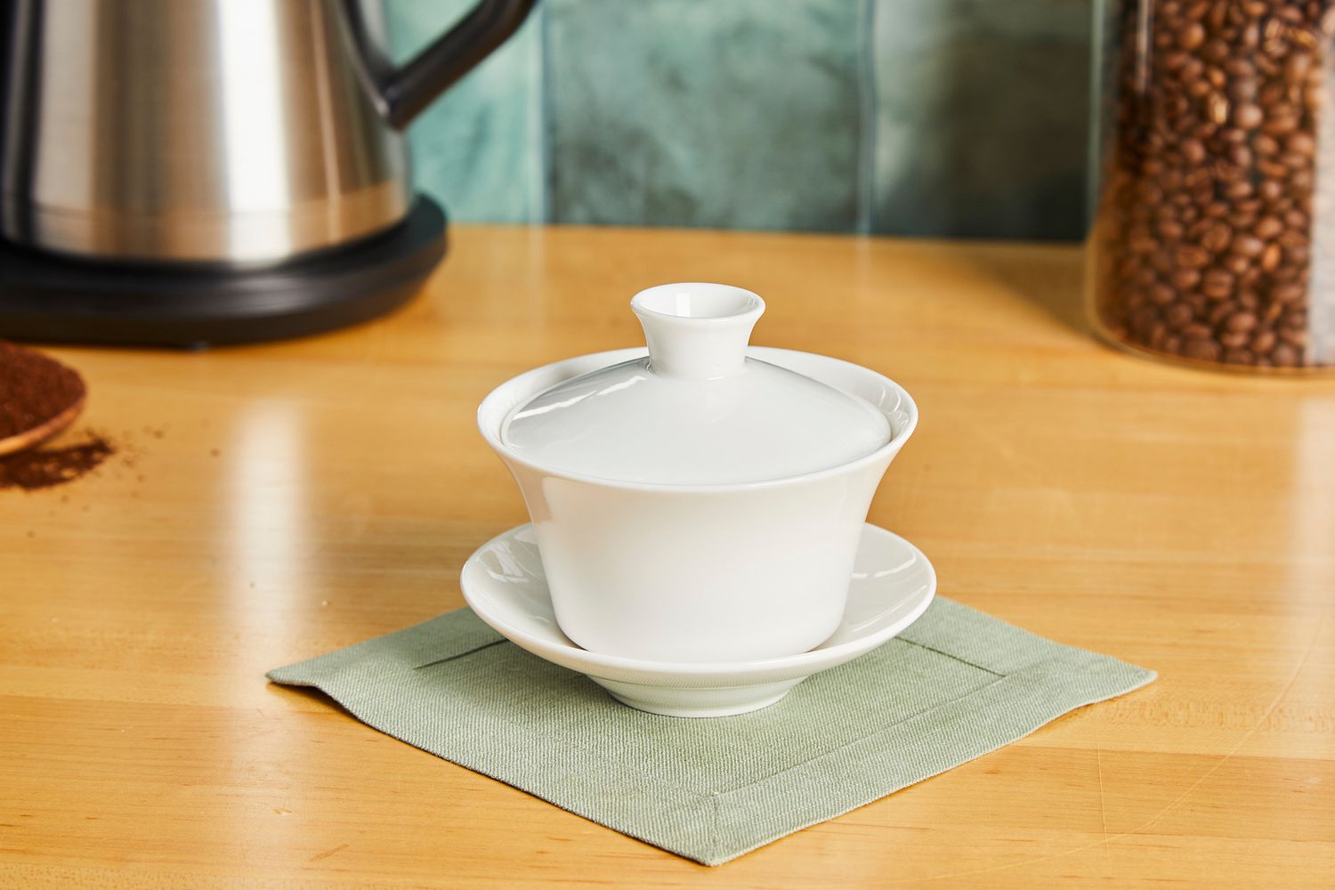 A lidded gaiwan on a kitchen countertop.