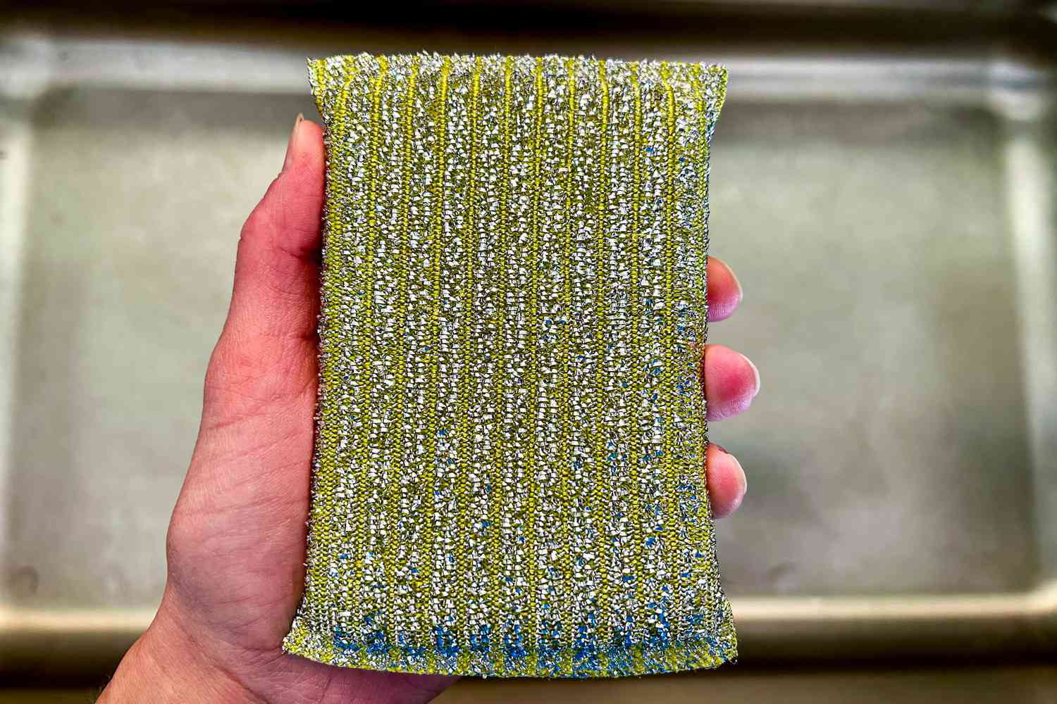 A sparkly gold dishwashing sponge from Hawkins New York