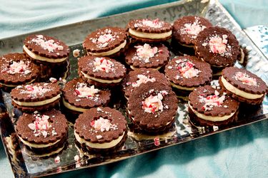 Tray of chocolate sandwich cookies topped with crushed peppermint