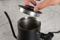 Person opening Fellow Stagg EKG Electric Gooseneck Kettle