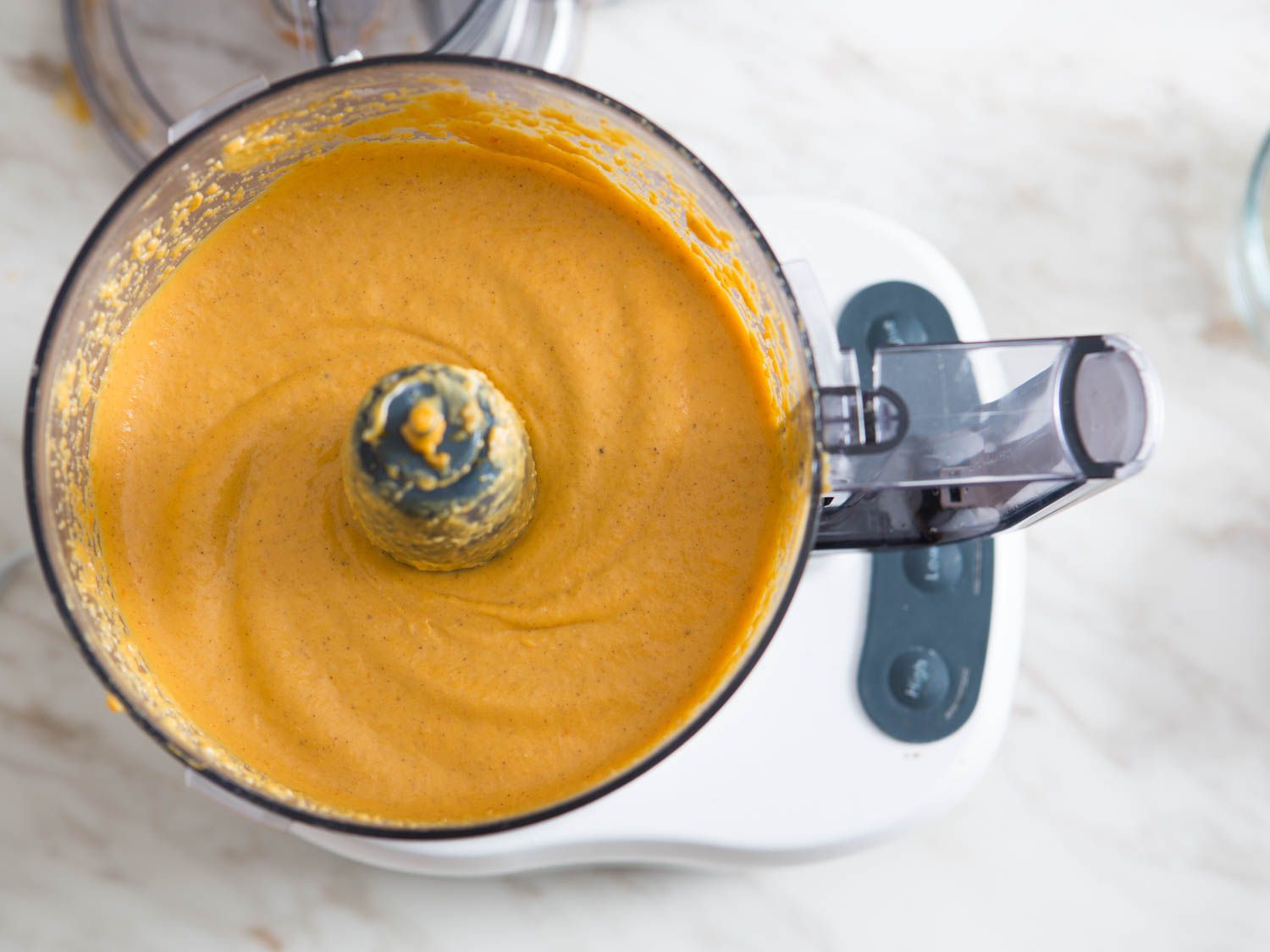 Smooth pumpkin pie filling in a food processor.