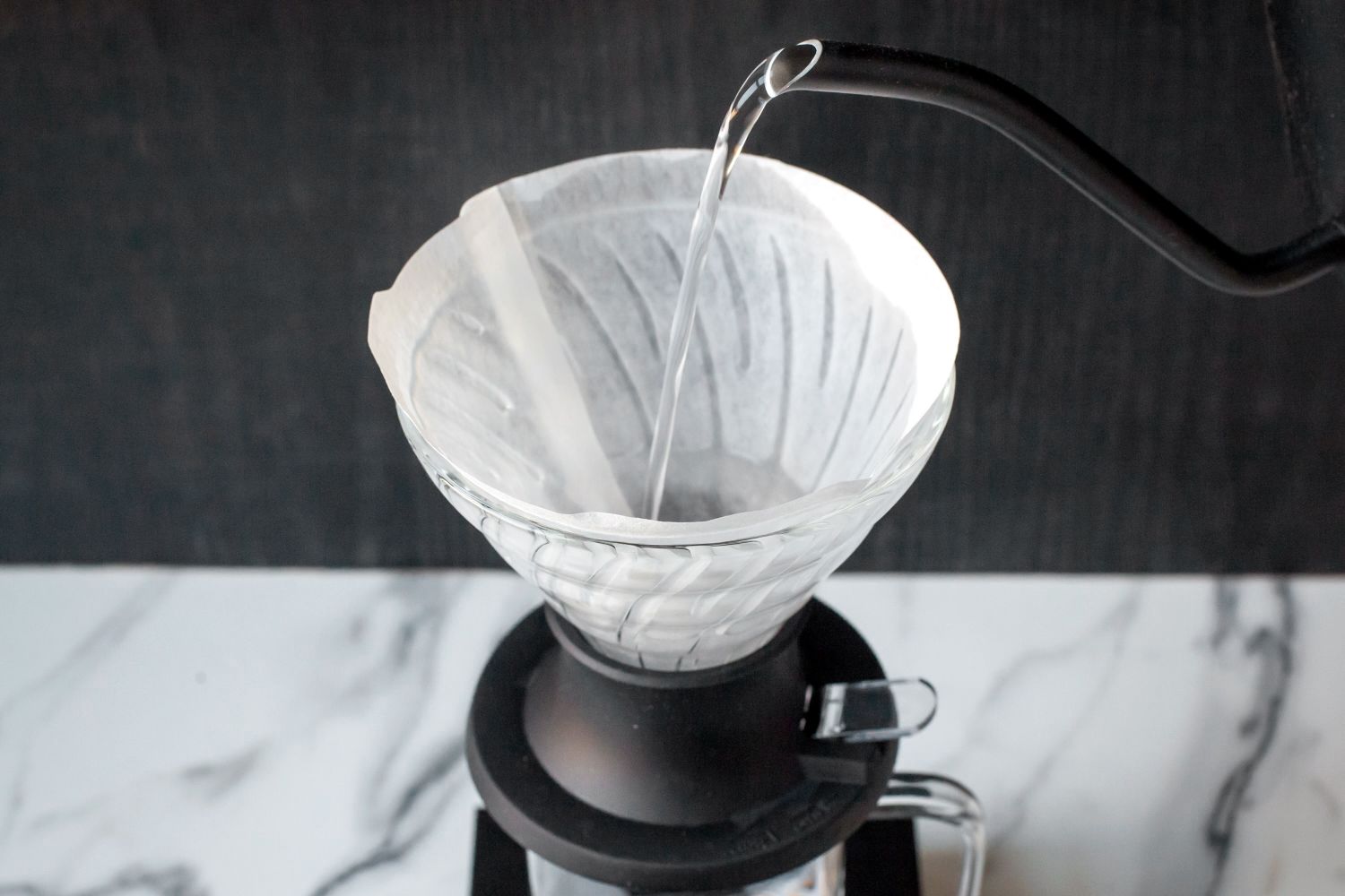Water being poured into the Hario Switch pour-over dripper