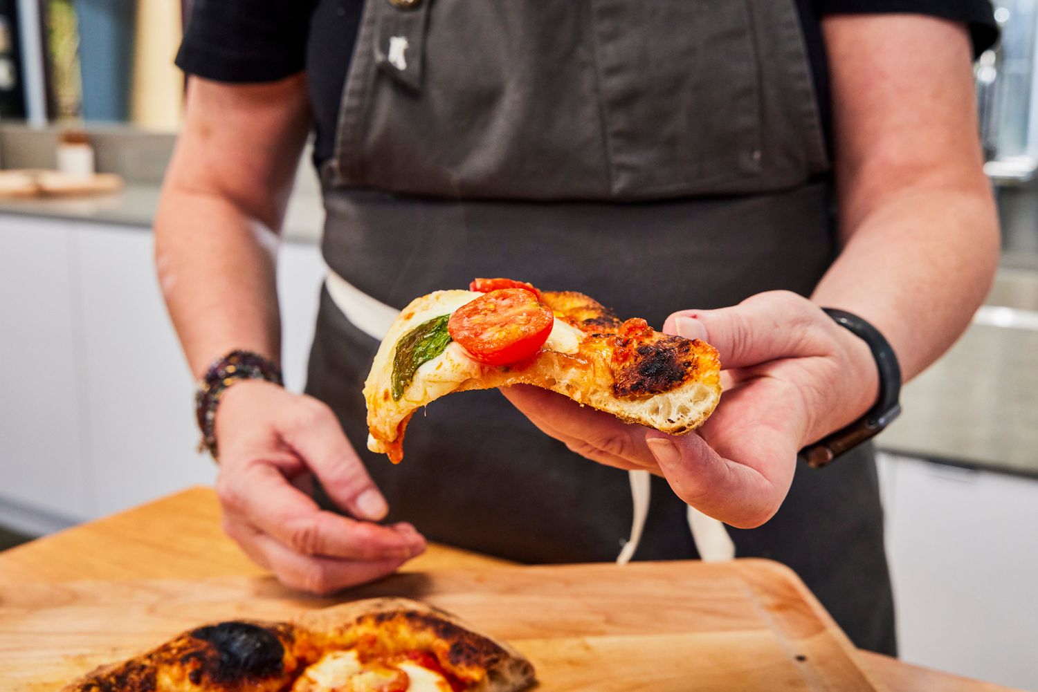 A slice of pizza cooked in the Breville Smart Oven Pizzaiolo Pizza Oven