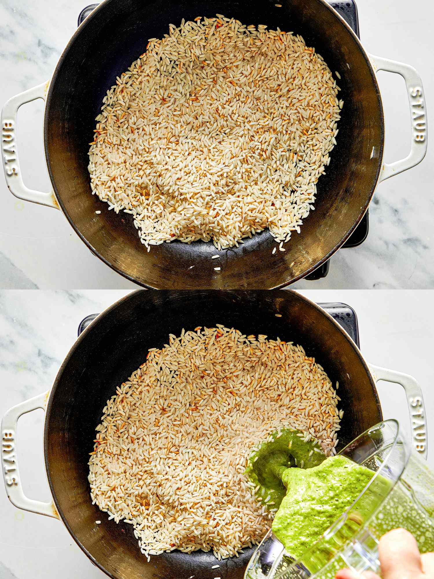Rice cooking in a black pot with green sauce being poured in
