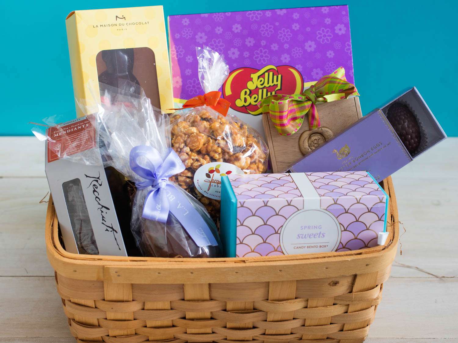 A basket of different candies and treats for Easter. 