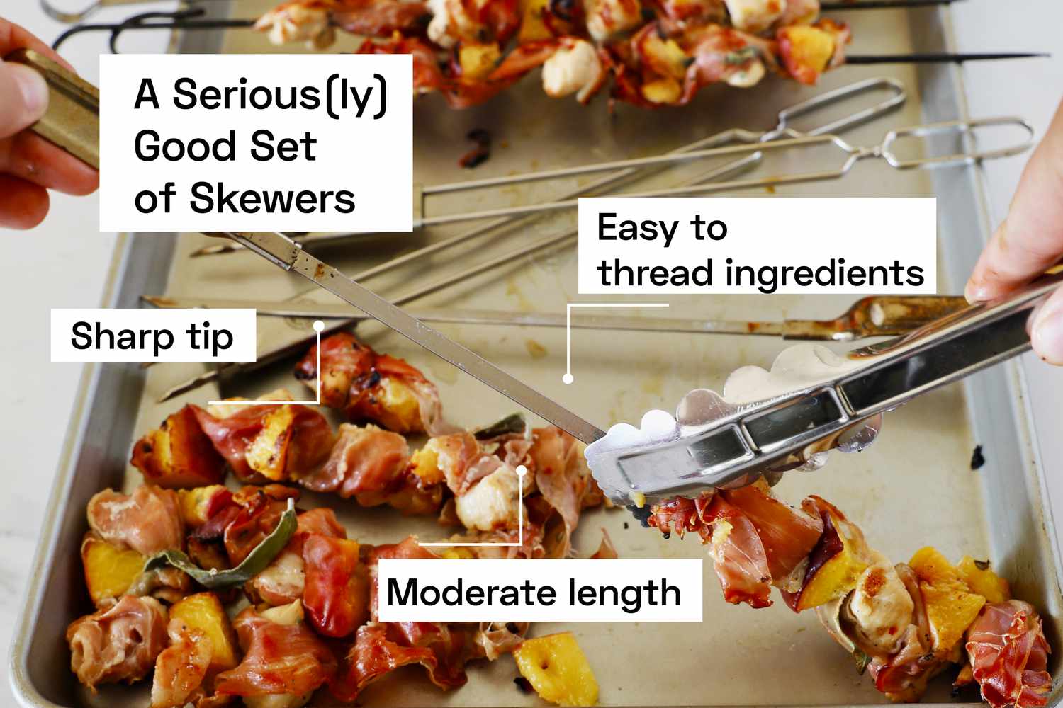 A pair of hands using tongs to remove cooked ingredients from a skewer