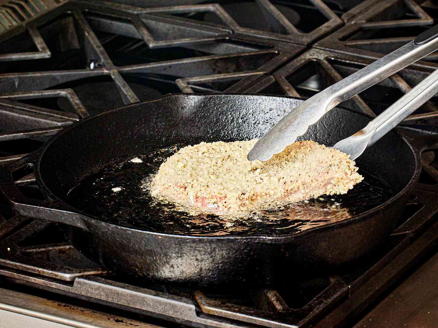 Overhead view of adding pork chop