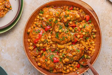 A skillet meal with chicken, chorizo, chickpeas, and vegetables
