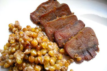 Sliced tongue confit with warm lentil salad