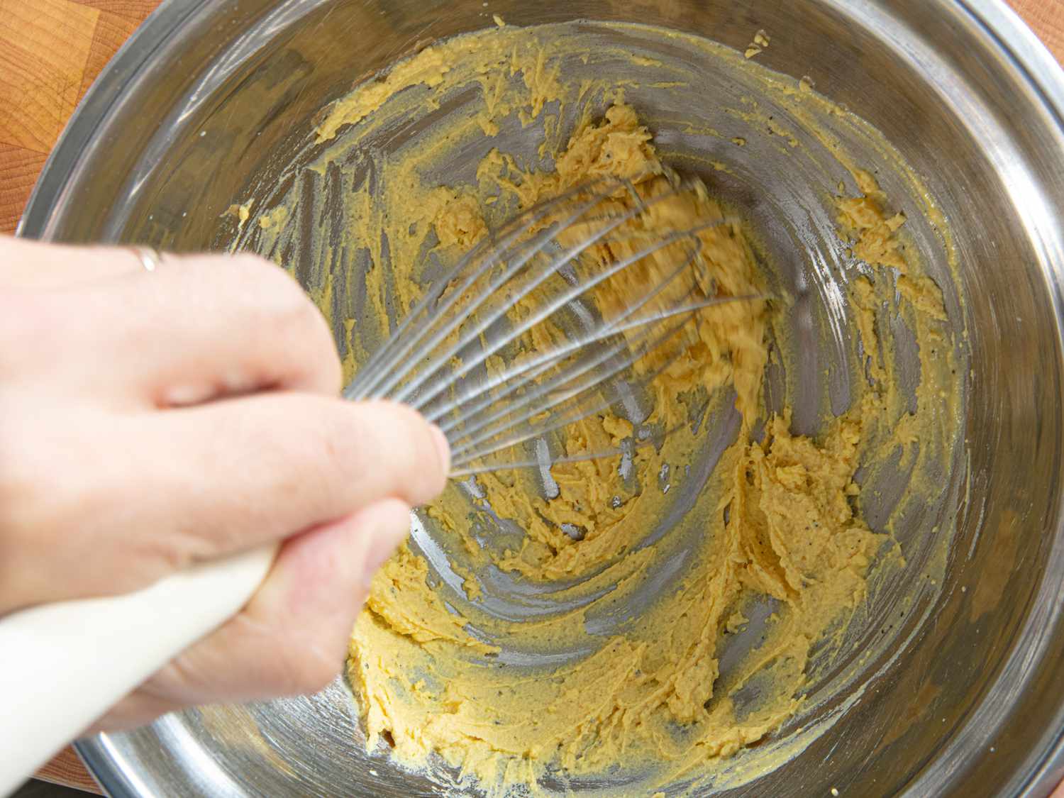 Overhead view of whisking eggs