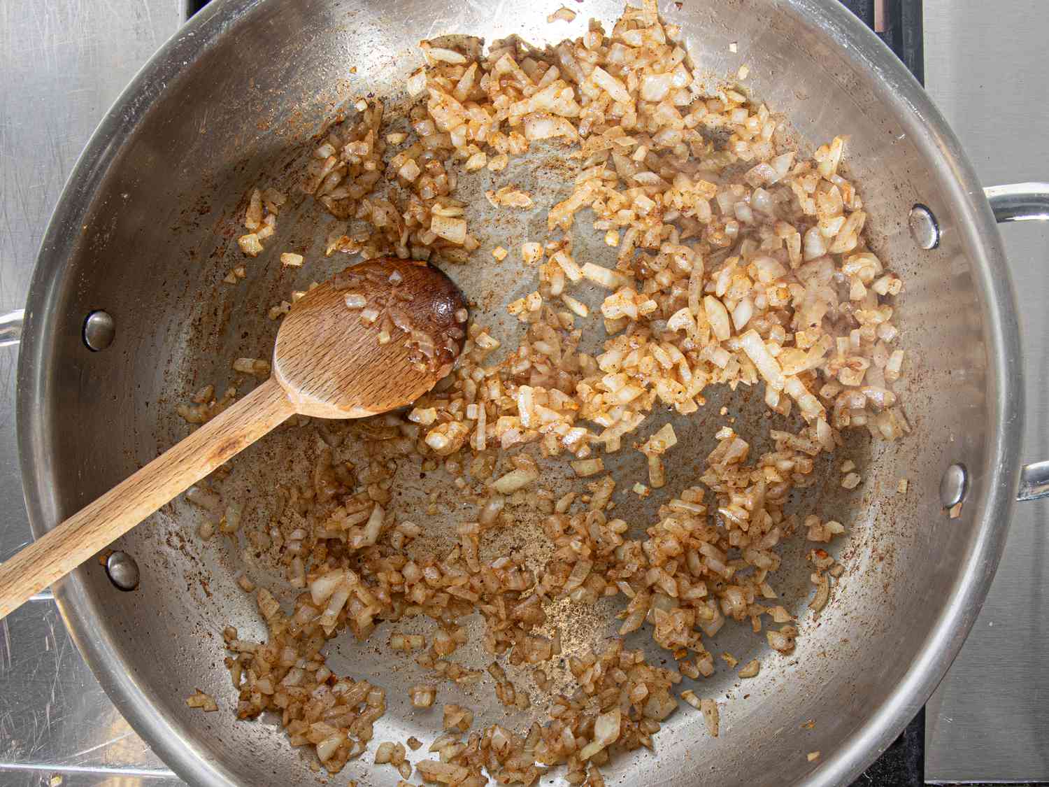 Overhead view of onions cooked in butter