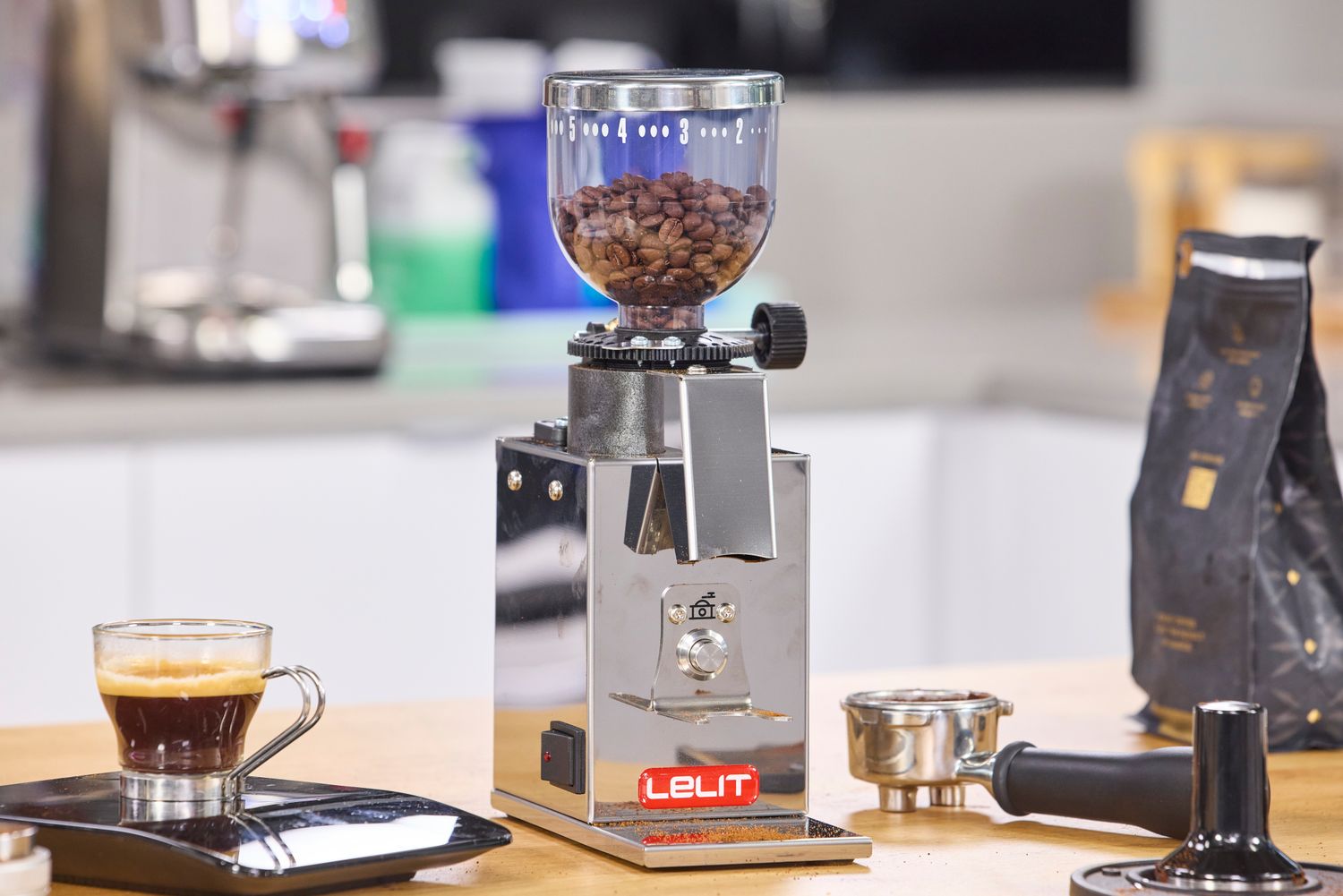 The Lelit Fred Tempo Burr Grinder filled with coffee beans
