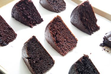 Multiple slices of chocolate cake arranged on a tray
