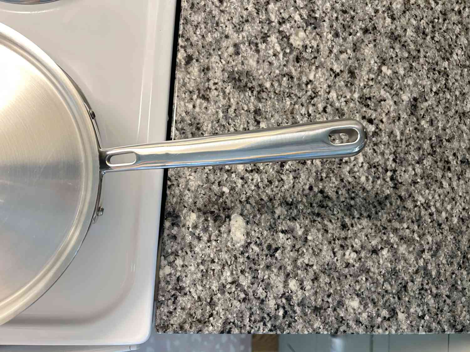 A closeup of the handle on the Misen 2-Quart Saucier.