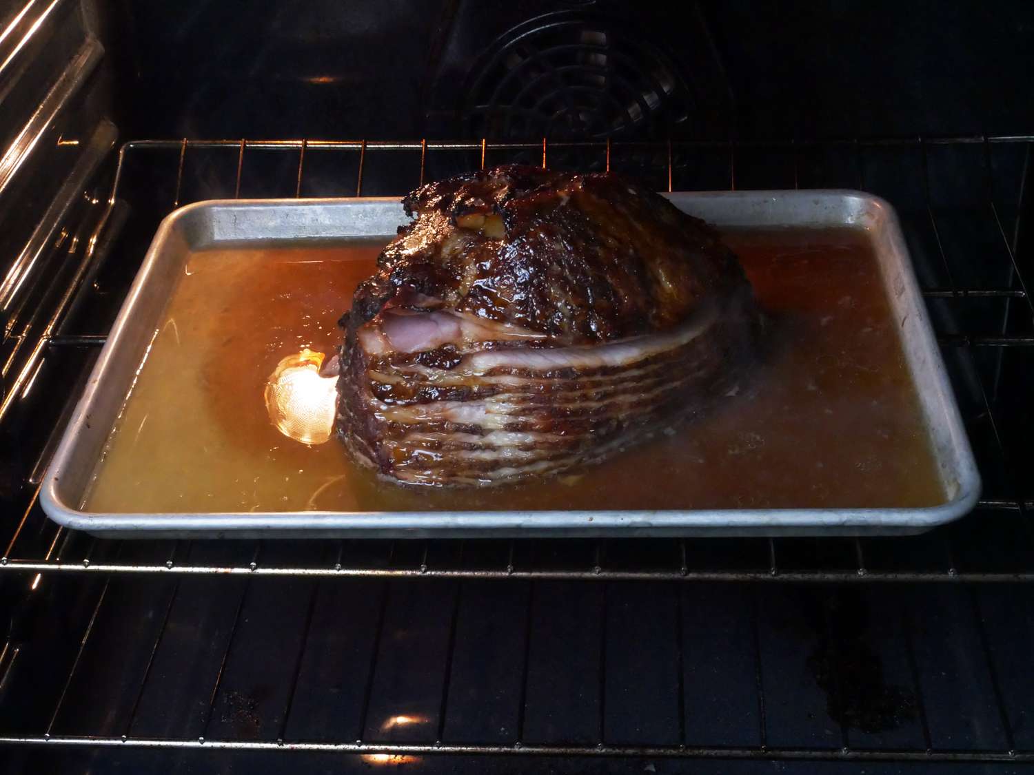 baking a ham on a sheetray with water in the oven