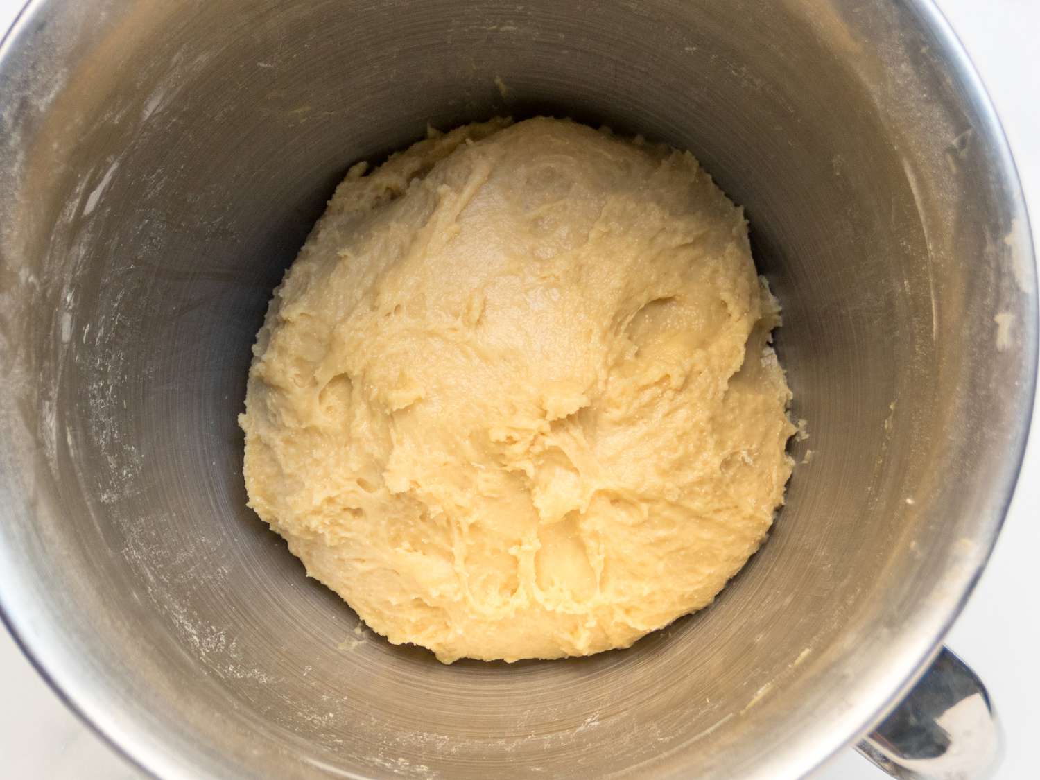 Dough, with sides scraped from the bowls from a mixer bowl. 
