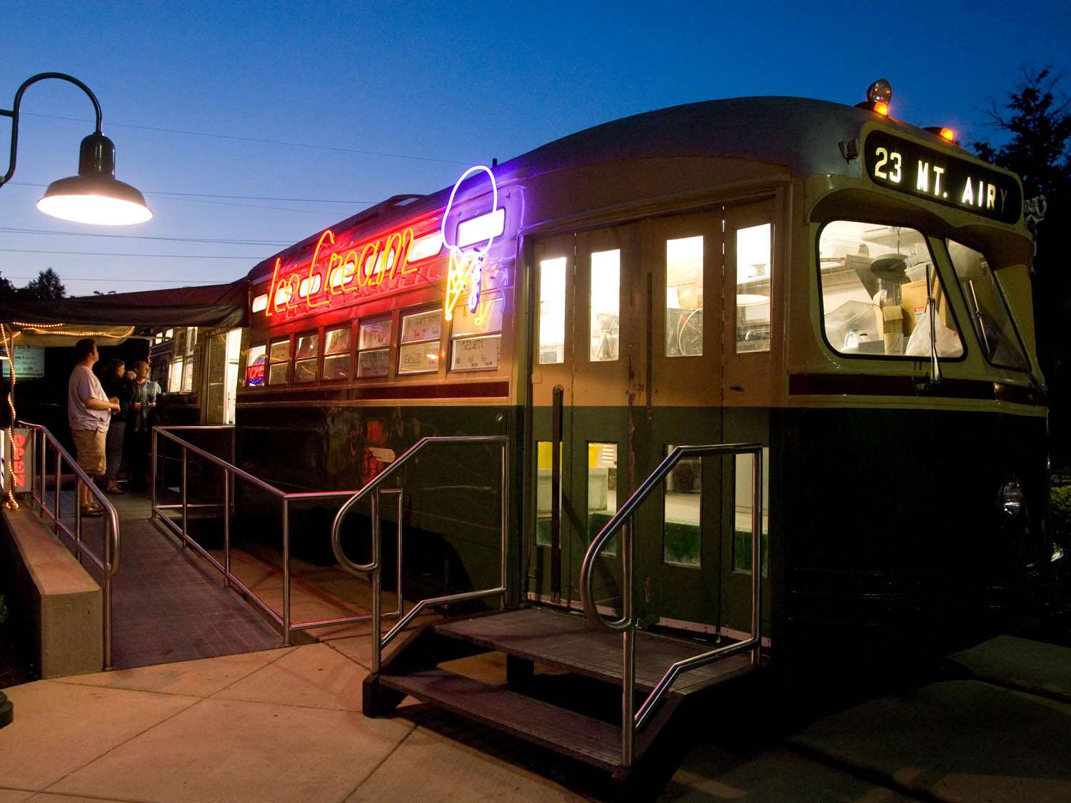 Trolly Car Diner and Deli in Philadelphia, pictured at night with the neon sign lit.