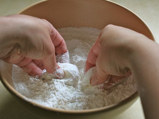 Lard is worked into the dry ingredients by hand for gluten-free tortillas.