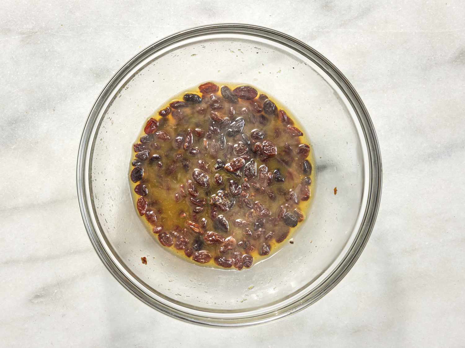 adding raisins in bowl 