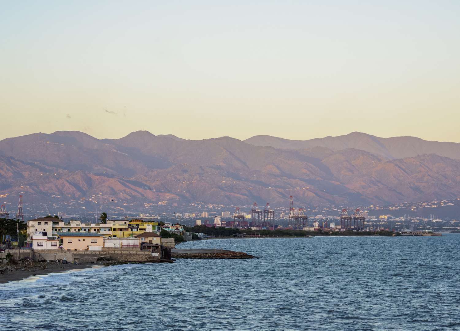 View over Cagway Bay towards Kingston and Blue Mountains at sunset,