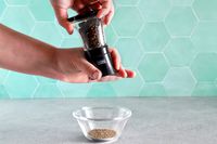 Person holding Kuhn Rikon Mini Pepper Grinder