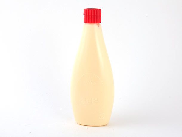 Squeeze bottle container of Kewpie mayonnaise with red lid.