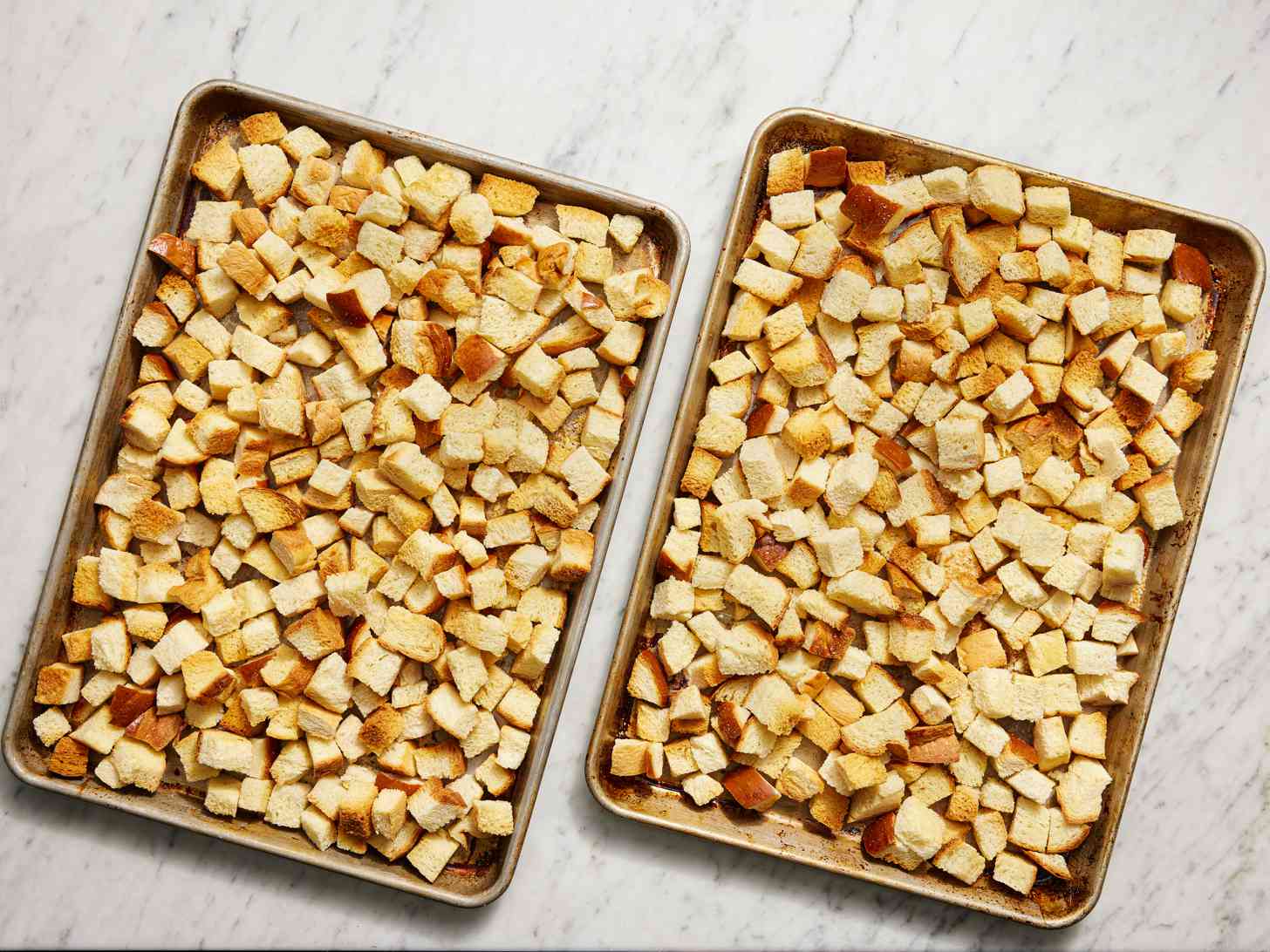 Breadcrumbs on two separate baking sheets