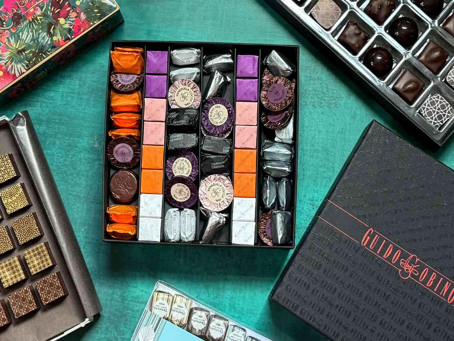 Guido Gobino Chocolate box opened with other boxes beside it