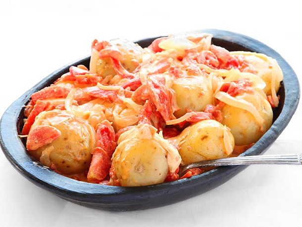 Papas Chorreadas (Colombian Potatoes with Cheese and Tomato Sauce)