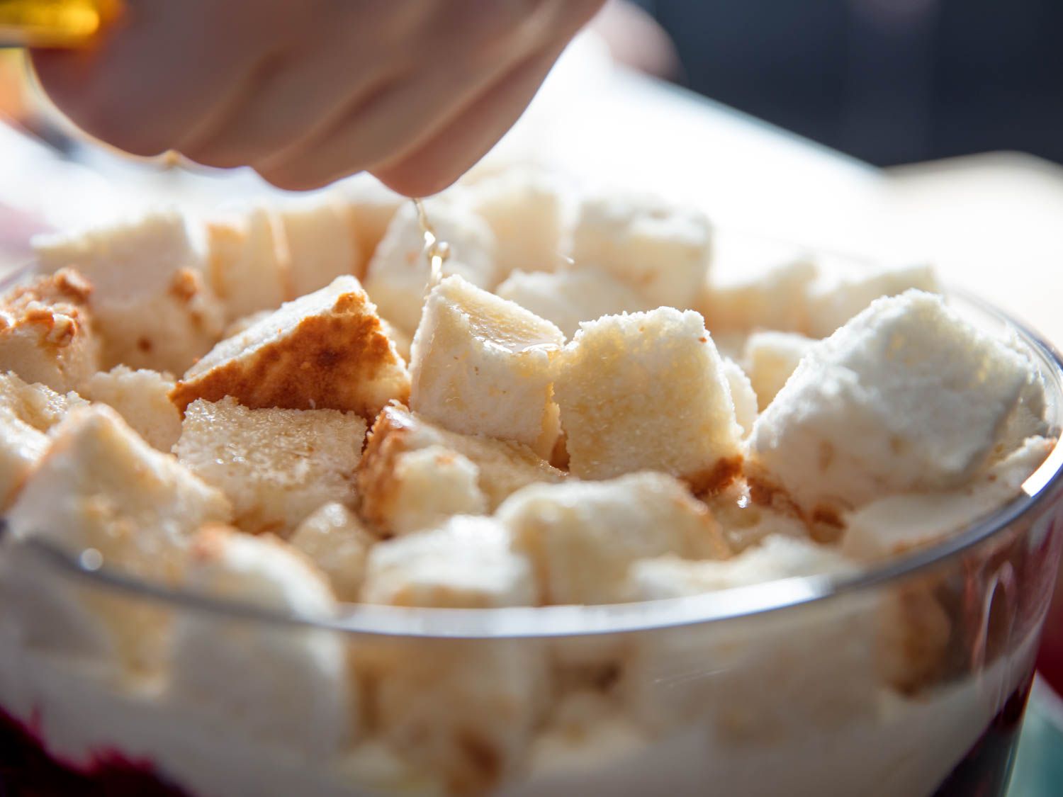 Cardamaro is sprinkled on one of the upper angel food cake layers.