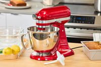 The KitchenAid Artisan Mini 3.5-Quart Tilt-Head Stand Mixer on a kitchen counter