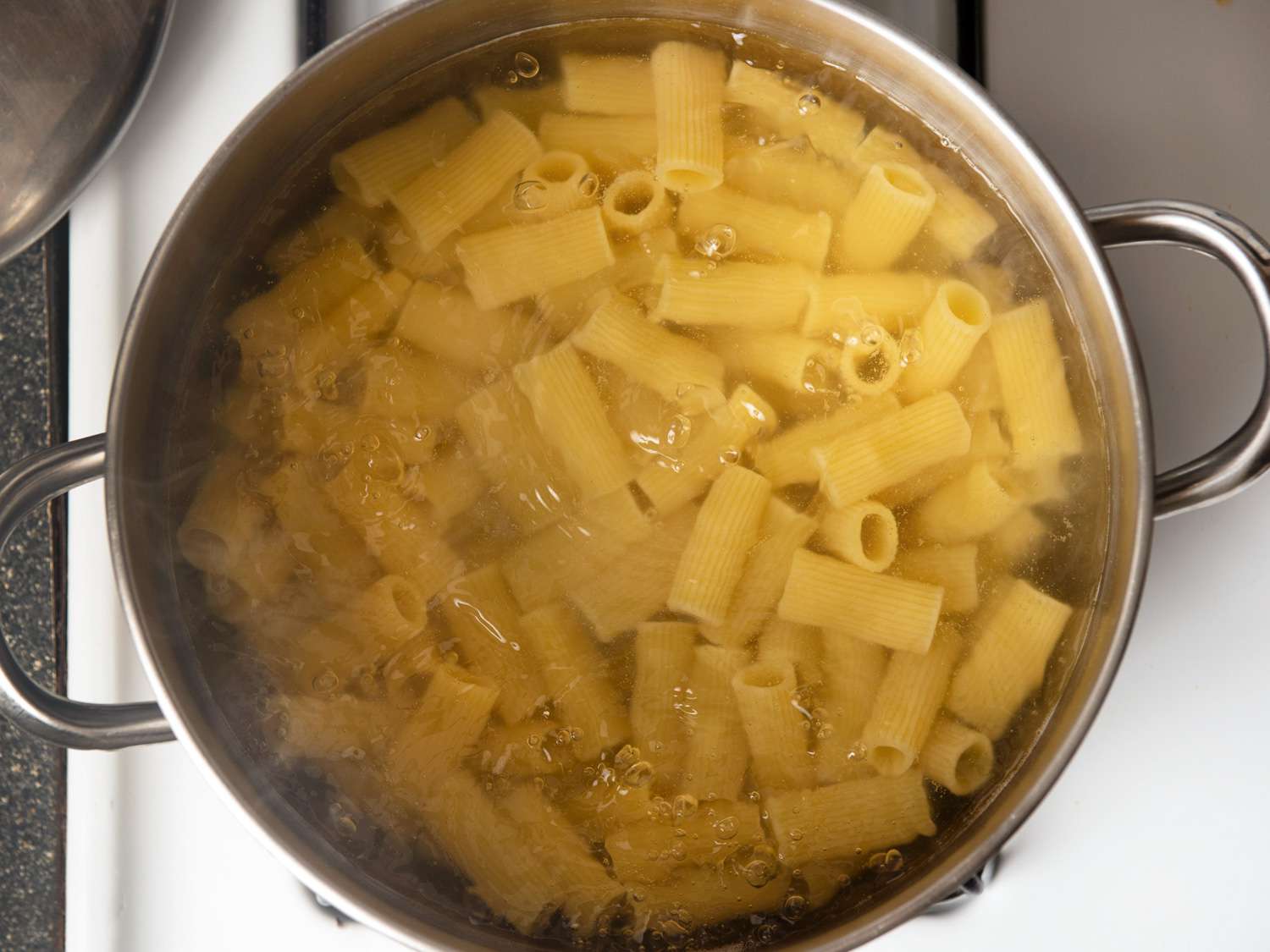 Overhead view of pasta boiling.