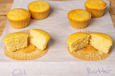 Four muffins labeled Oil and Butter one muffin from each group sliced in half to show texture