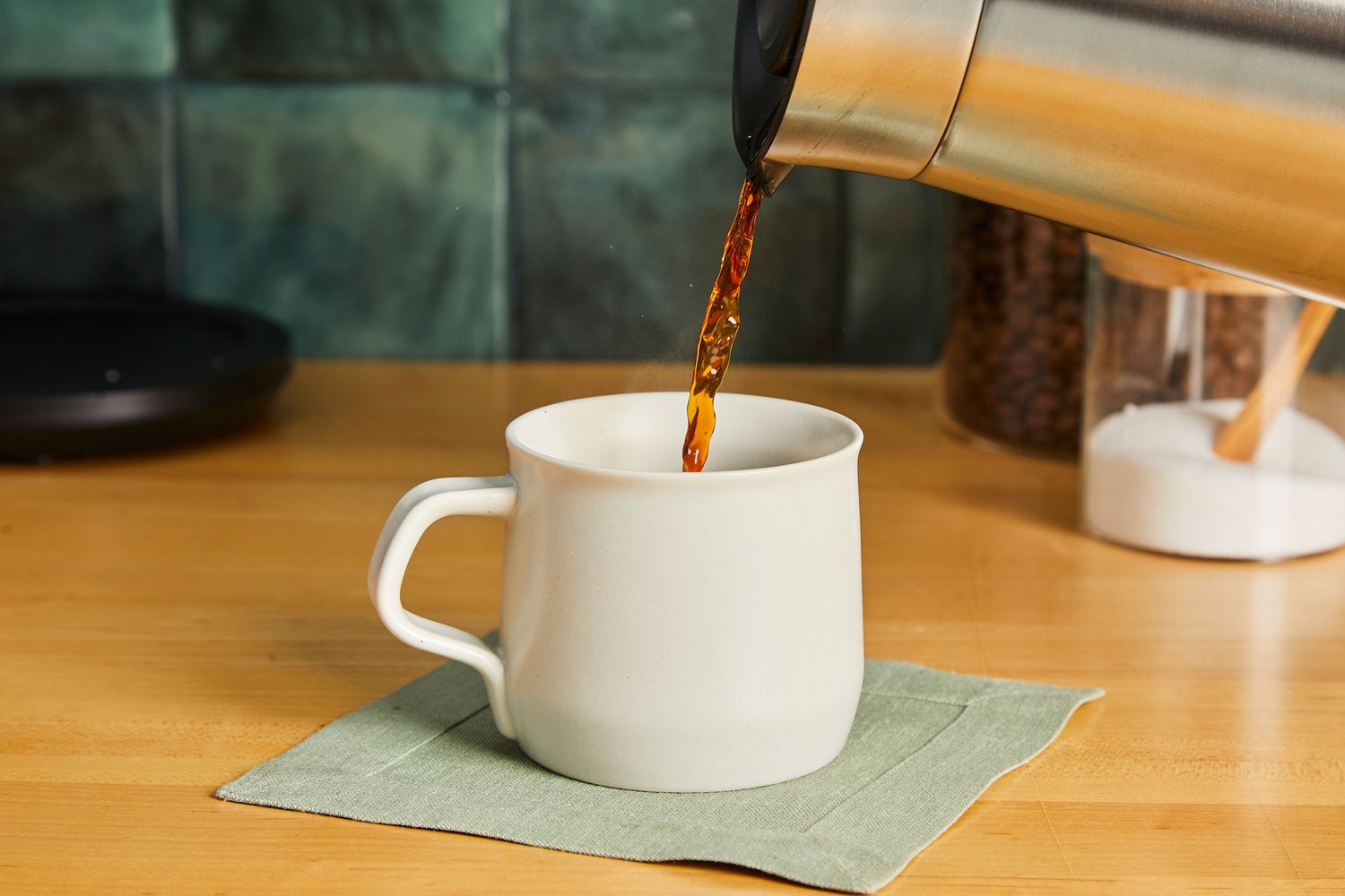 Coffee being poured into the Kinto Fog coffee mug.