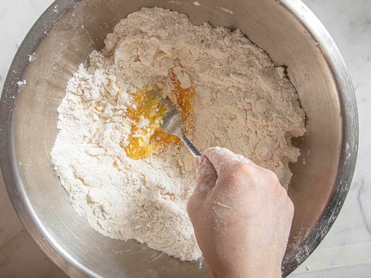 Overhead view of adding eggs