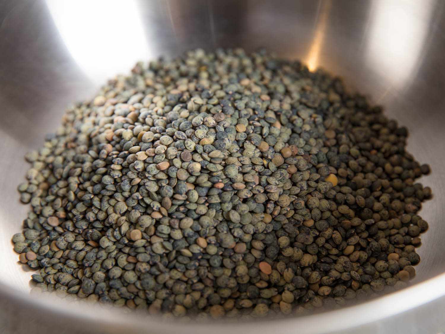 A bowl of dried French lentils 