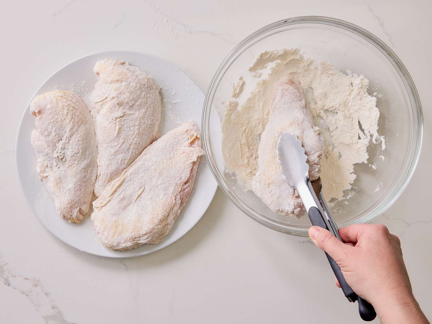Dredging chicken in wide bowl with flower 