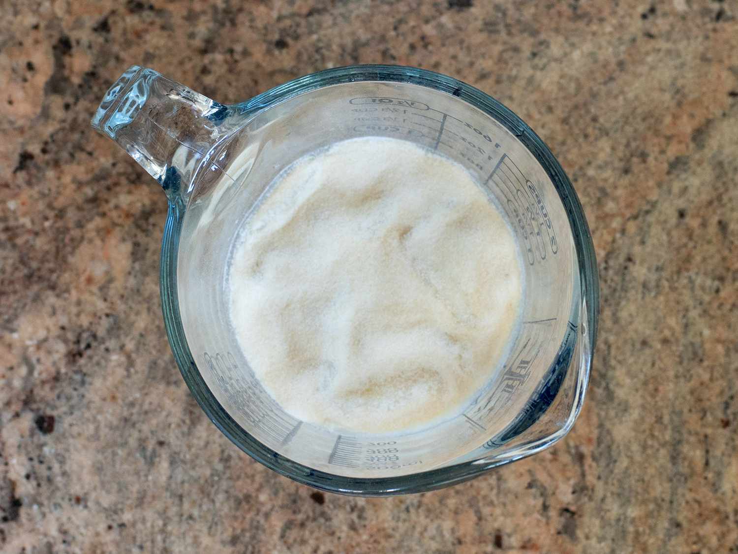 Buttermilk, chicken stock, and gelatin in a measuring cup