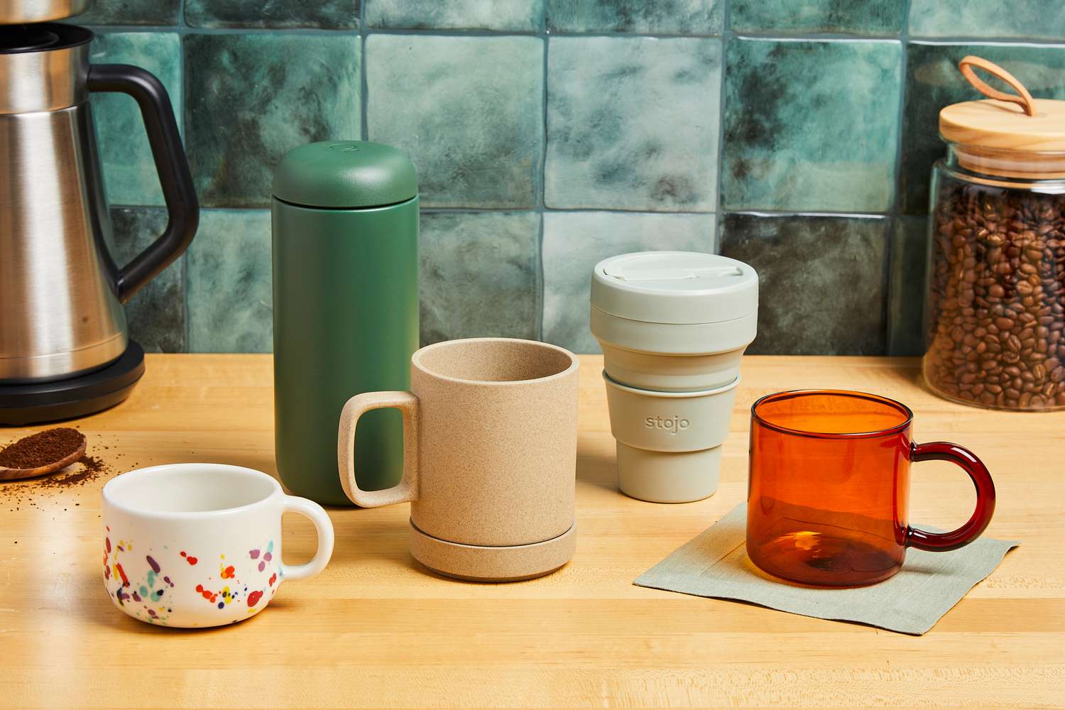 Various coffee mugs on a kitchen countertop.