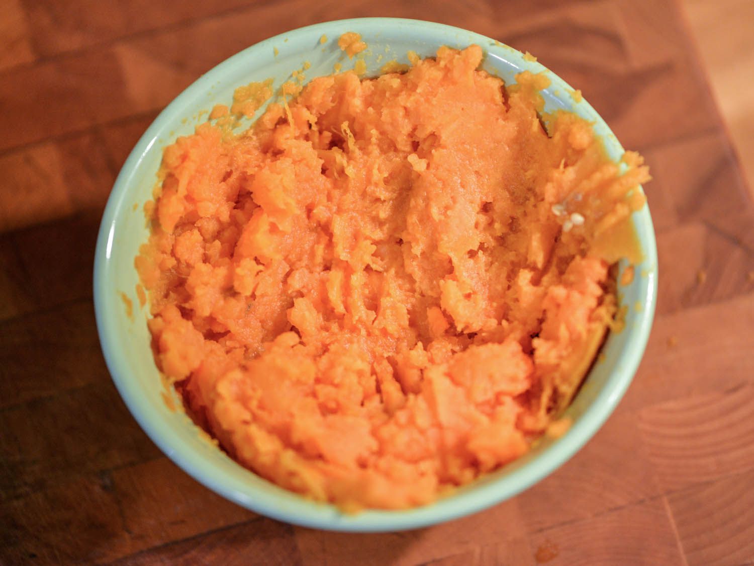 Overhead shot of a bowl of mashed sweet potato.