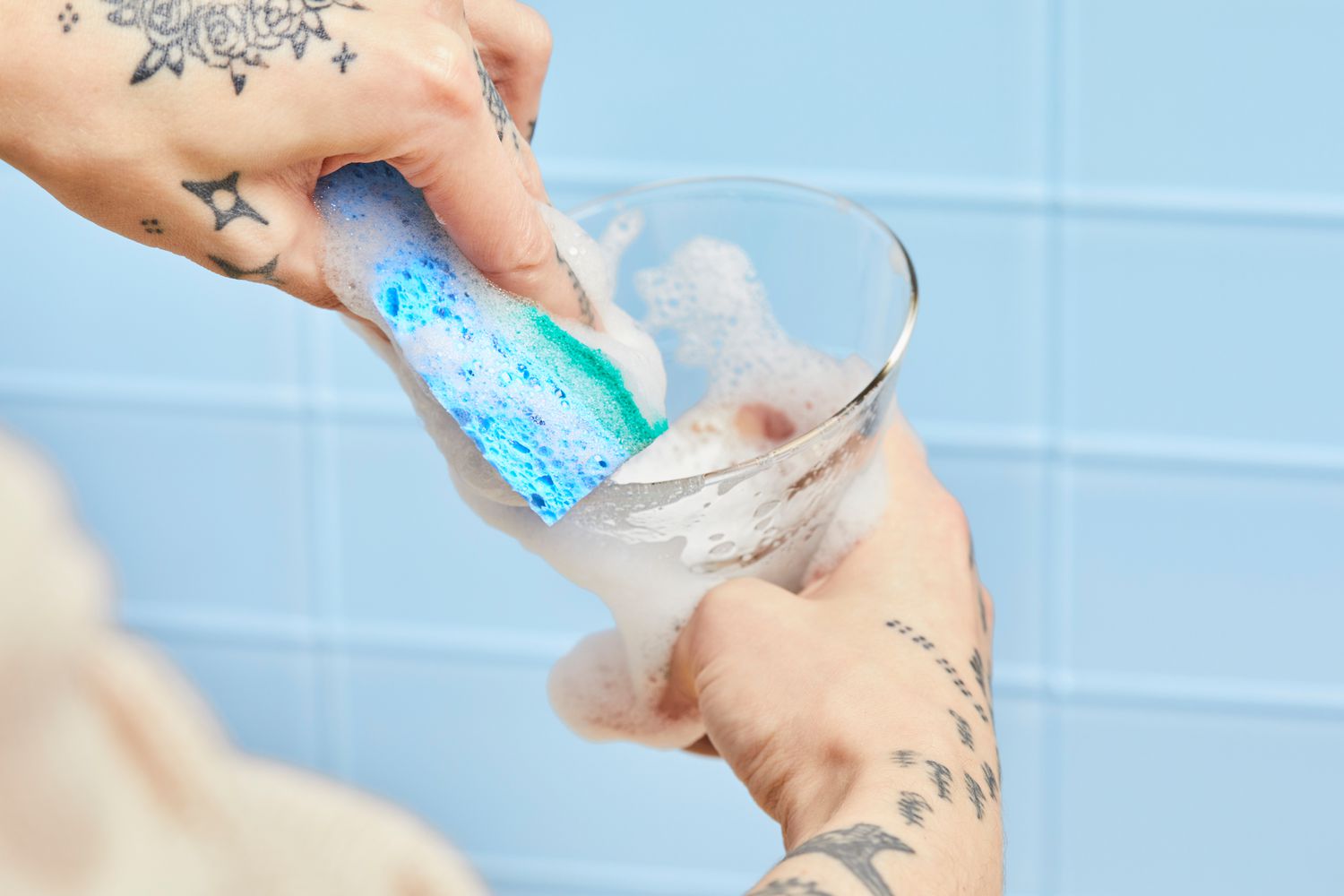 Person cleaning Libbey Cosmopolitan Stemless Glass