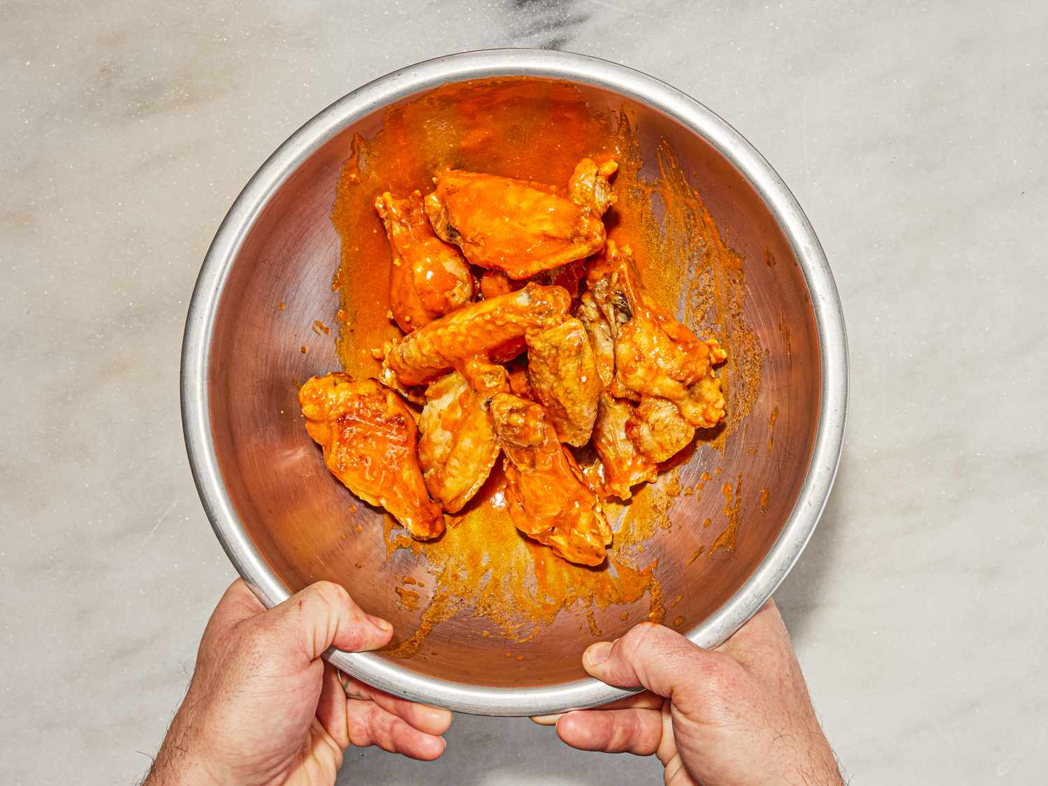 Overhead view of buffalo wings in bowl