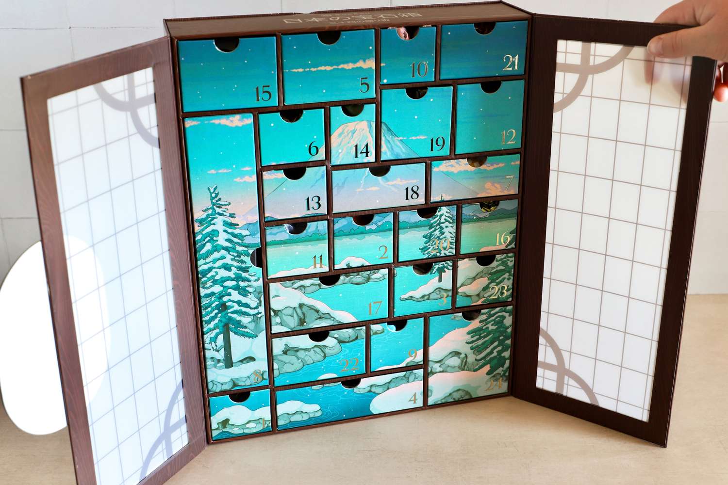 The Bokksu Advent Calendar, opened and propped on a table