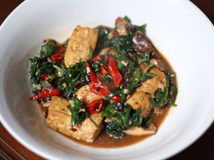 A bowl of Home-Style Tofu with Mushrooms, Spinach, and Fermented Black Beans