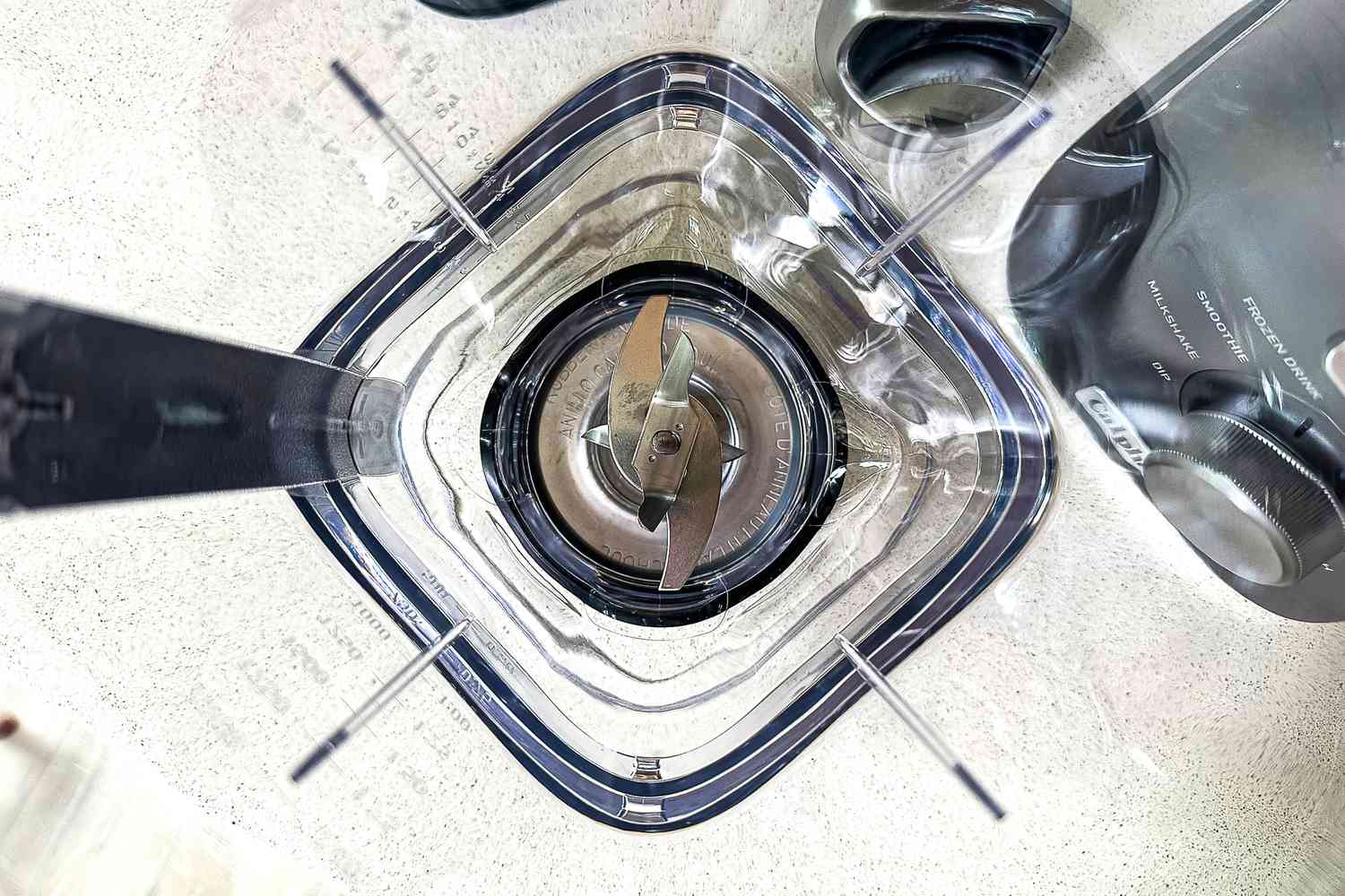 A top-down look at the blades inside the Calphalon Auto Speed 68-Ounce Blender jar.