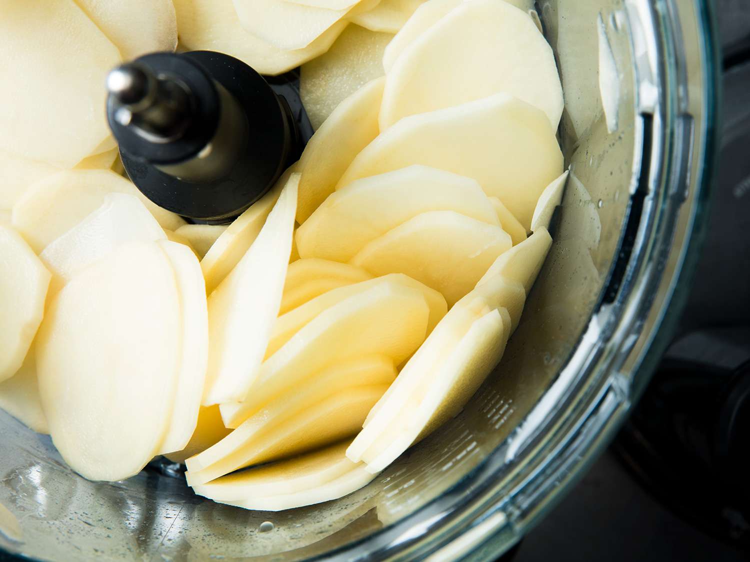 Slicing potatoes in a food processor